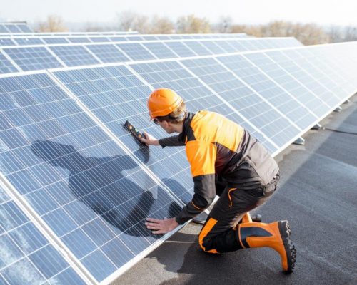 worker-installing-solar-panels-2021-09-01-15-20-44-utc